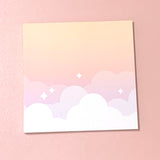 Small memo pad with cloudbank cloud design on yellow to purple gradient background design 